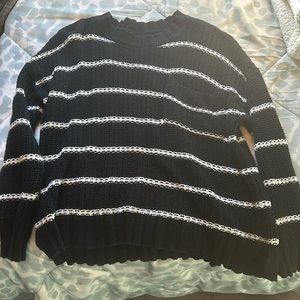 black and white knit sweater with chest pocket